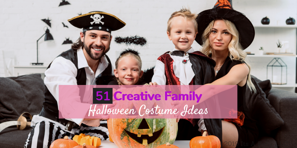 Family wearing family themed halloween costumes